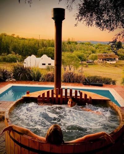two people in a jacuzzi in a pool at Valle de Domos - Minas in Minas