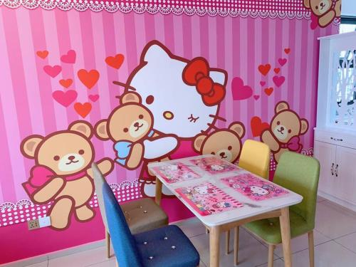 a room with a table witheddy bears and a hello kitty wall at 2BR 8pax SwingDuplexEkocherasMall—InfinityPool MRT in Kuala Lumpur