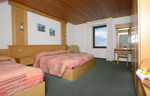 Ένα ή περισσότερα κρεβάτια σε δωμάτιο στο Savoia Hotel