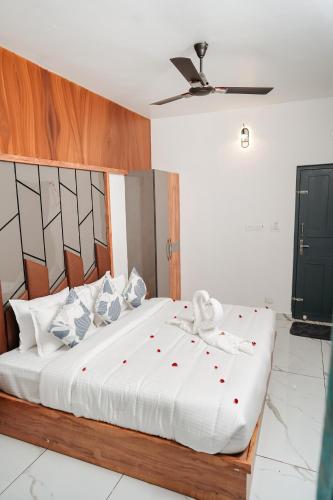 a bedroom with a large bed with red polka dots on it at Spring Valley in Anachal