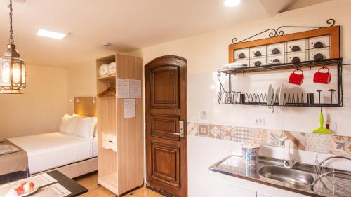 Η κουζίνα ή μικρή κουζίνα στο Hotel Chalet Monet - Granja Vianna