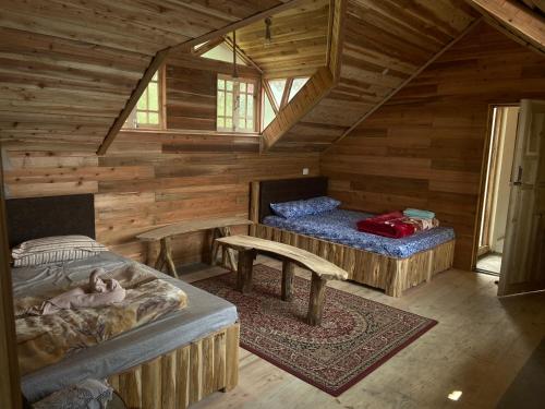 A bed or beds in a room at Hermit Retreat