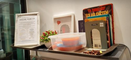 a shelf with a box and some food on it at Sunway Paradise Home Staycation PH2120 SELF CHECK IN OUT in Subang Jaya