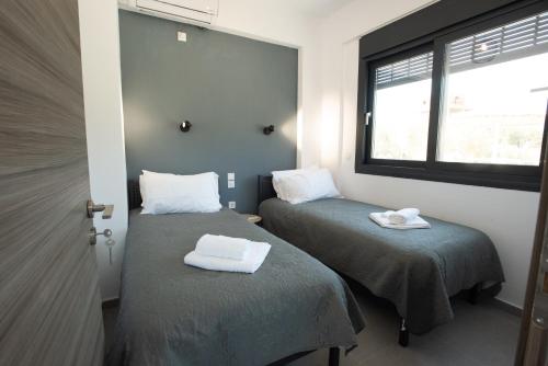 Postel nebo postele na pokoji v ubytování ELIA Boutique Villas