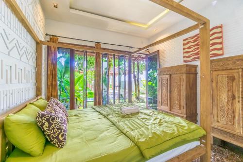 Villa Omah Kangen tesisinde bir odada yatak veya yataklar