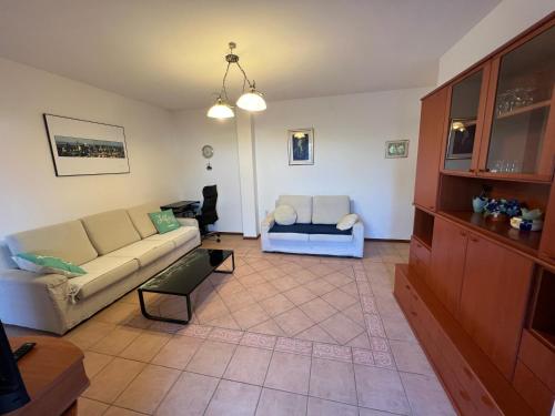 a living room with a couch and a table at APARTMENT LUKA Novalja in Novalja