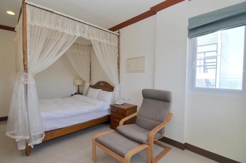 Postel nebo postele na pokoji v ubytování Xinghai Seaview Guesthouse