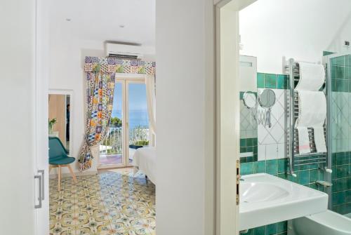 a bathroom with a sink and a mirror at B&B Il Sogno in Anacapri