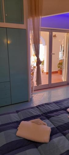 a mattress on the floor of a room with a mirror at Casa Vacanze Elianto in Anzio