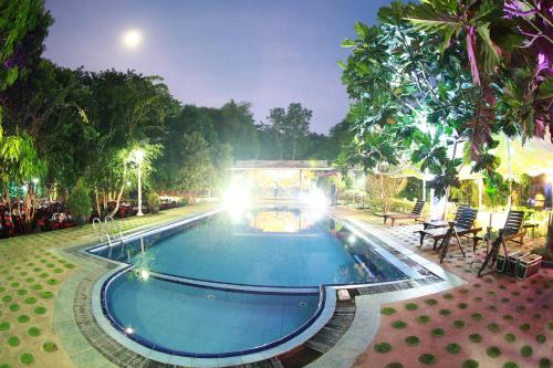 a swimming pool in a park at night at Wet Water Resort in Gampaha