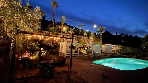 a swimming pool in a yard at night at Charming Bellagio Boutique Hotel in Bellagio