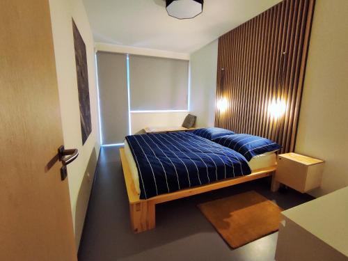 Säng eller sängar i ett rum på Apartmán SVAN B2