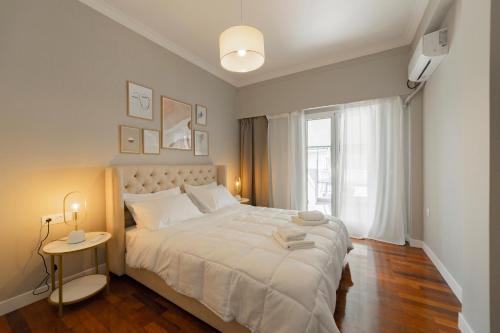 Posteľ alebo postele v izbe v ubytovaní HoneyBee Apartment