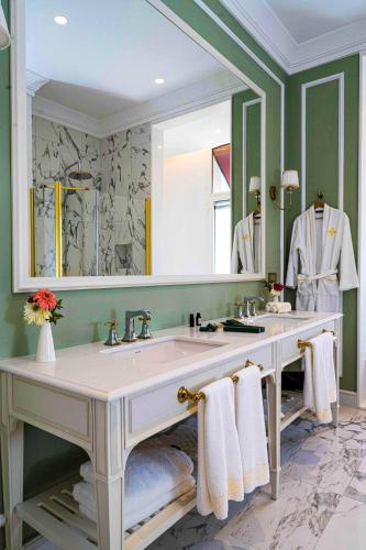 a bathroom with a sink and a large mirror at ANIM Boutique Hotel in Denizli