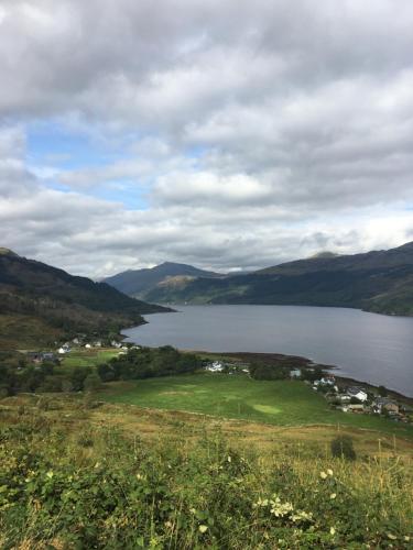 a view of a large body of water with mountains at Rowan House B&B Rooms & A Self Catering Apartment in Lochgoilhead