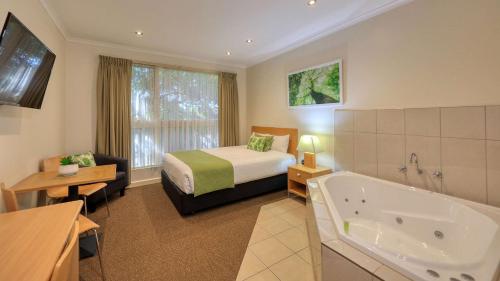 A bed or beds in a room at Quality Inn Swan Hill