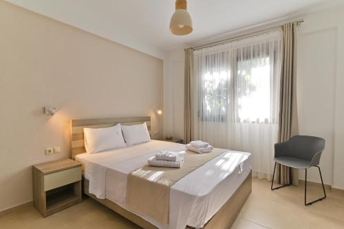 Ένα ή περισσότερα κρεβάτια σε δωμάτιο στο Kalli's Apartments