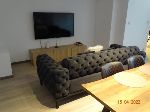 A television and/or entertainment center at Appartement Deluxe