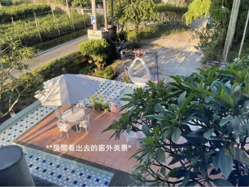 a garden with a table and a playground at Full House Homestay in Yuchi