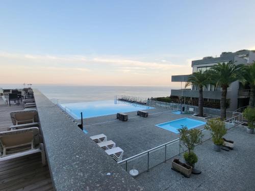 a view of a swimming pool on top of a building at Cap Monaco in Cap d'Ail