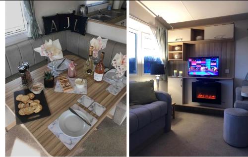 a living room with a couch and a table and a tv at AJL Caravan Rentals in Turnberry
