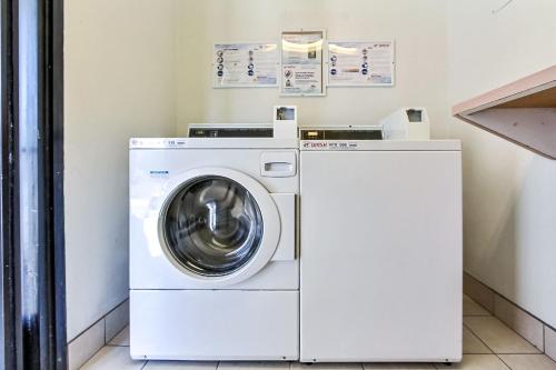 a white washer and dryer in a room at Motel 6-Fremont, CA - North in Fremont