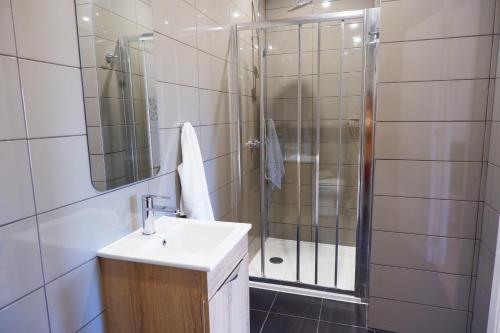 a bathroom with a sink and a shower at Retiro de Gondramaz - All house 200 m2 in Gondramaz