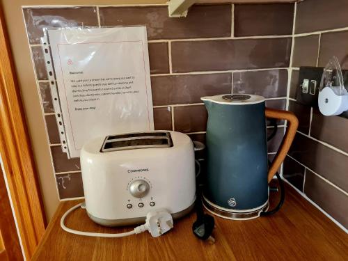 a toaster and a blender sitting on a counter at The Goat House 