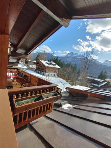 a view from the roof of a building with mountains in the background at Mansarda in chalet a Cortina in Cortina dʼAmpezzo