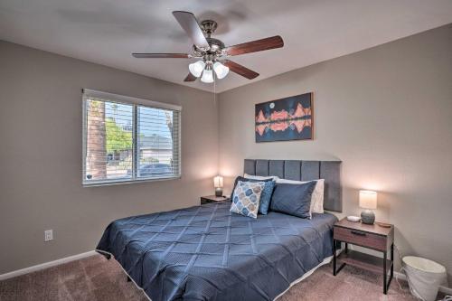 a bedroom with a bed and a ceiling fan at Private Pool and Playground Phoenix Family Home! in Phoenix