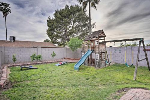 a backyard with a playground with a slide at Private Pool and Playground Phoenix Family Home! in Phoenix