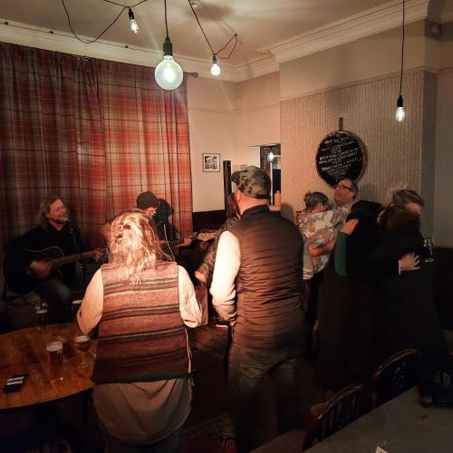 a group of people standing in a room at Trawden Arms Community Owned Pub in Winewall
