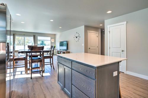 a kitchen and dining room with a table and chairs at Charming Home with Mtn and Columbia River Views! in East Wenatchee