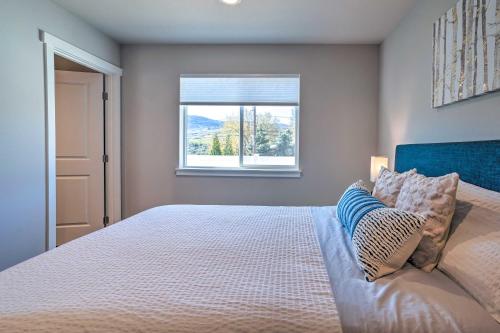 a bedroom with a large bed with a window at Charming Home with Mtn and Columbia River Views! in East Wenatchee