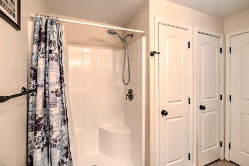 a bathroom with a shower with a shower curtain at Bristol Escape with Patio, 2 Mi to Downtown! in Bristol