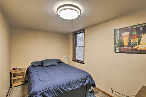 a bedroom with a bed in a room at Dtwn Sheboygan Apt Above Local Bar! in Sheboygan