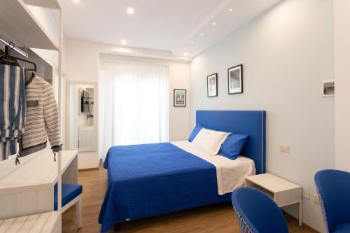 A bed or beds in a room at TOFANI APARTMENT - luminoso con terrazzo panoramico