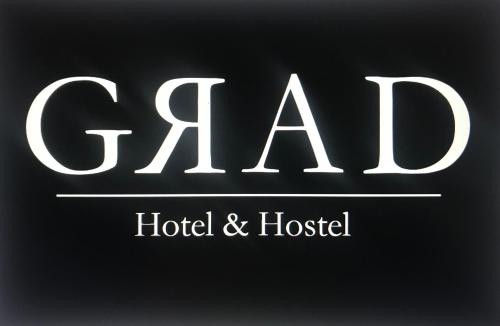 a black and white photo of a restaurant sign at Grad Hotel and Hostel in Stockholm