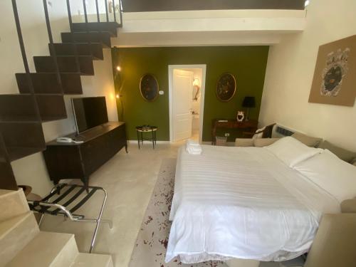 Ένα ή περισσότερα κρεβάτια σε δωμάτιο στο Scilla Maris Charming Suites