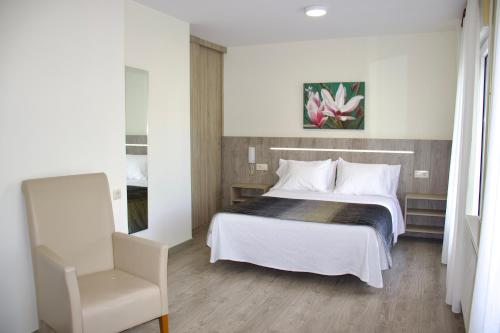 Katil atau katil-katil dalam bilik di Hotel Playa de Lago