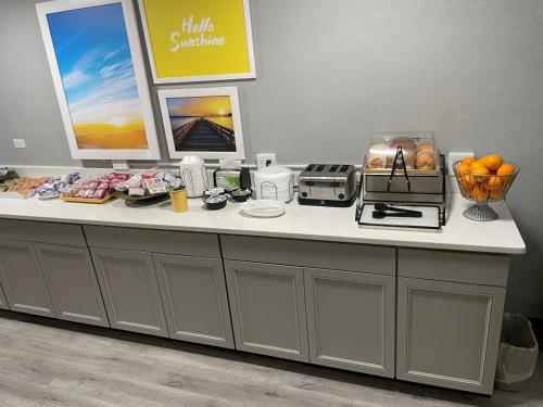 a counter in a store with aasteryasteryasteryasteryasteryasteryasteryasteryastery at Days Inn by Wyndham Port Charlotte Town Center in Port Charlotte