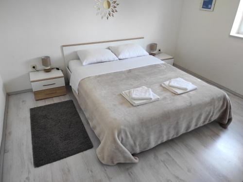 Postel nebo postele na pokoji v ubytování Apartman Eli 2