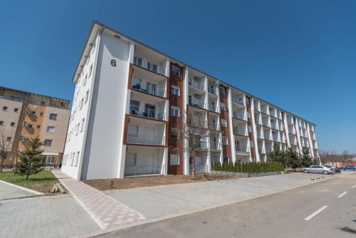 an apartment building on the side of a street at Apartman Adriana in Banja Koviljača
