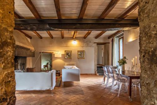 a living room with a table and chairs at Astar Civita in Bagnoregio