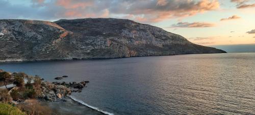 a view of a body of water with a mountain at OSTRIA BOUTIQUE HOME in Kalymnos