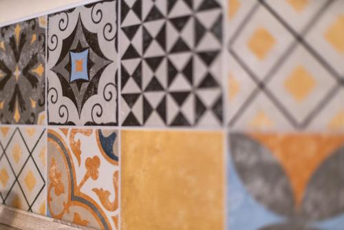 a tiled wall with a bunch of different colored tiles at TREEHOUSE - KiDS PARADISE - CENTRAL - SSC in Winterberg