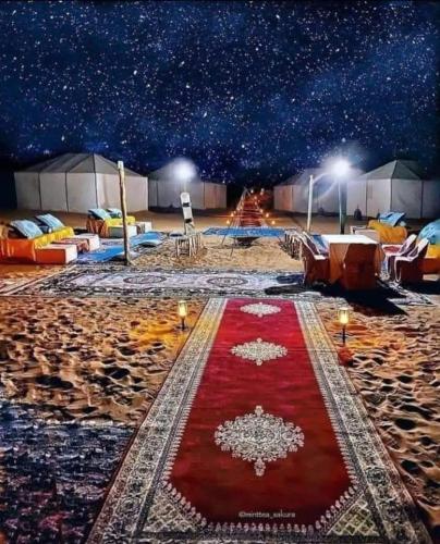 a starry night with a red carpet on the beach at Bivouac ZAGORA in Zagora