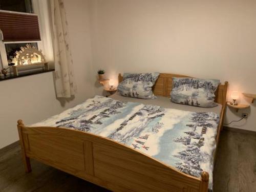 Ein Bett oder Betten in einem Zimmer der Unterkunft Ferienwohnung Groß