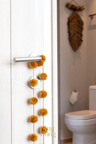 a close up of a bathroom door with a toilet at Máritima Golf New apartment private beach access in Nuevo Vallarta 