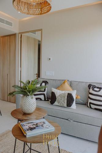 a living room with a couch and a table at Máritima Golf New apartment private beach access in Nuevo Vallarta 